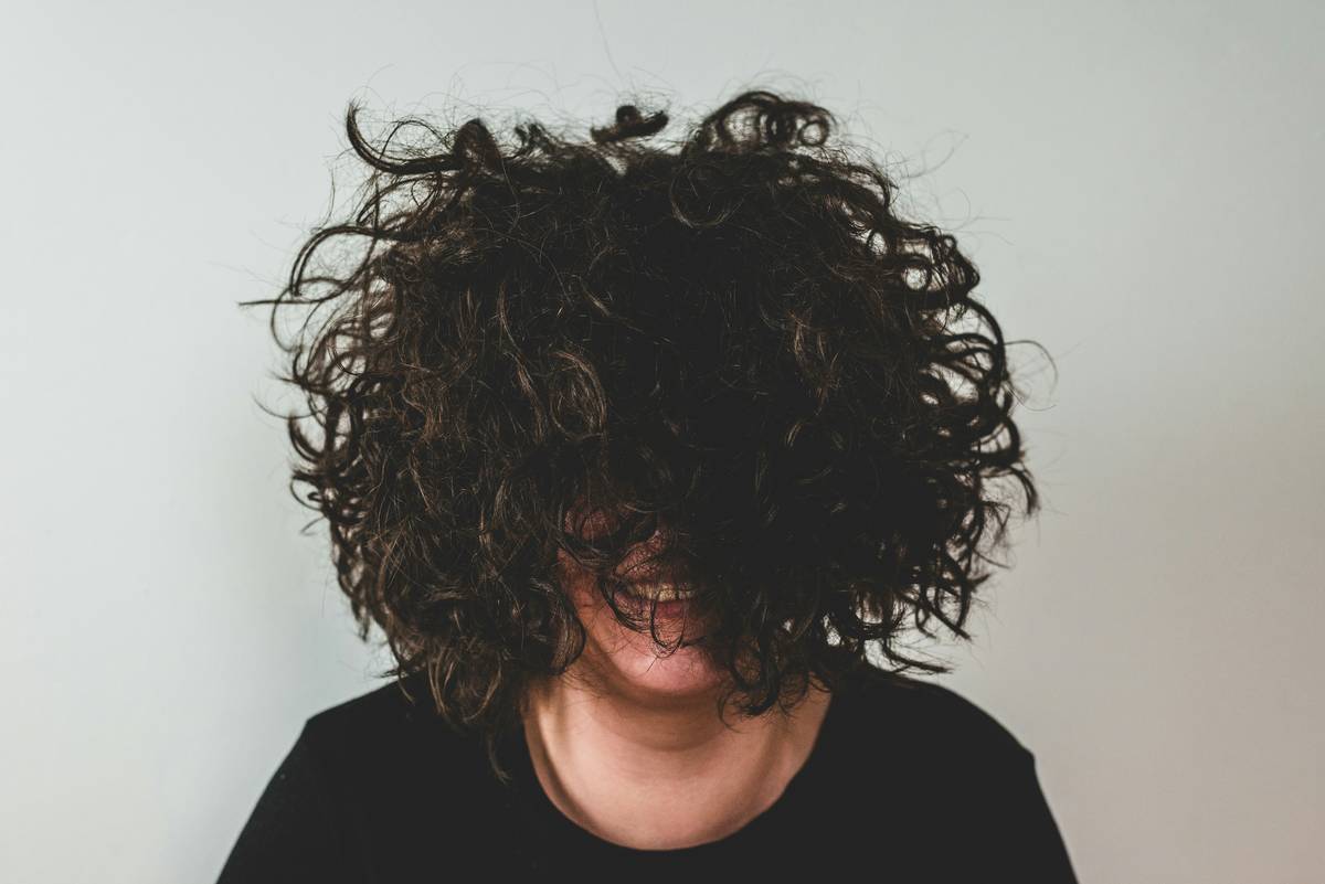 Close-up of styled hair using firm hold hair gel showing flexible texture without white flakes
